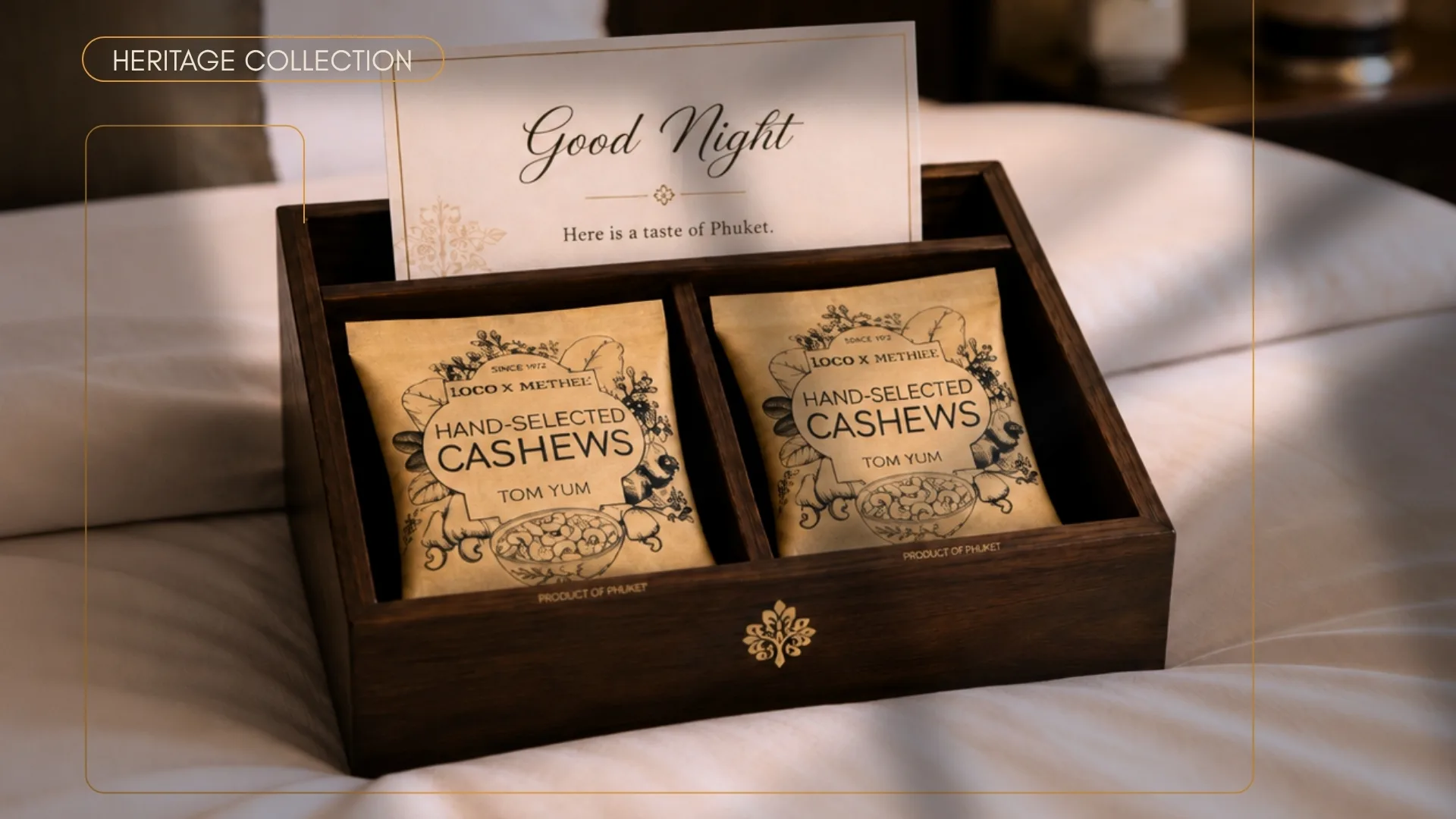 Wooden turndown service box on a bed with heritage cashew sachets and a Good Night note card